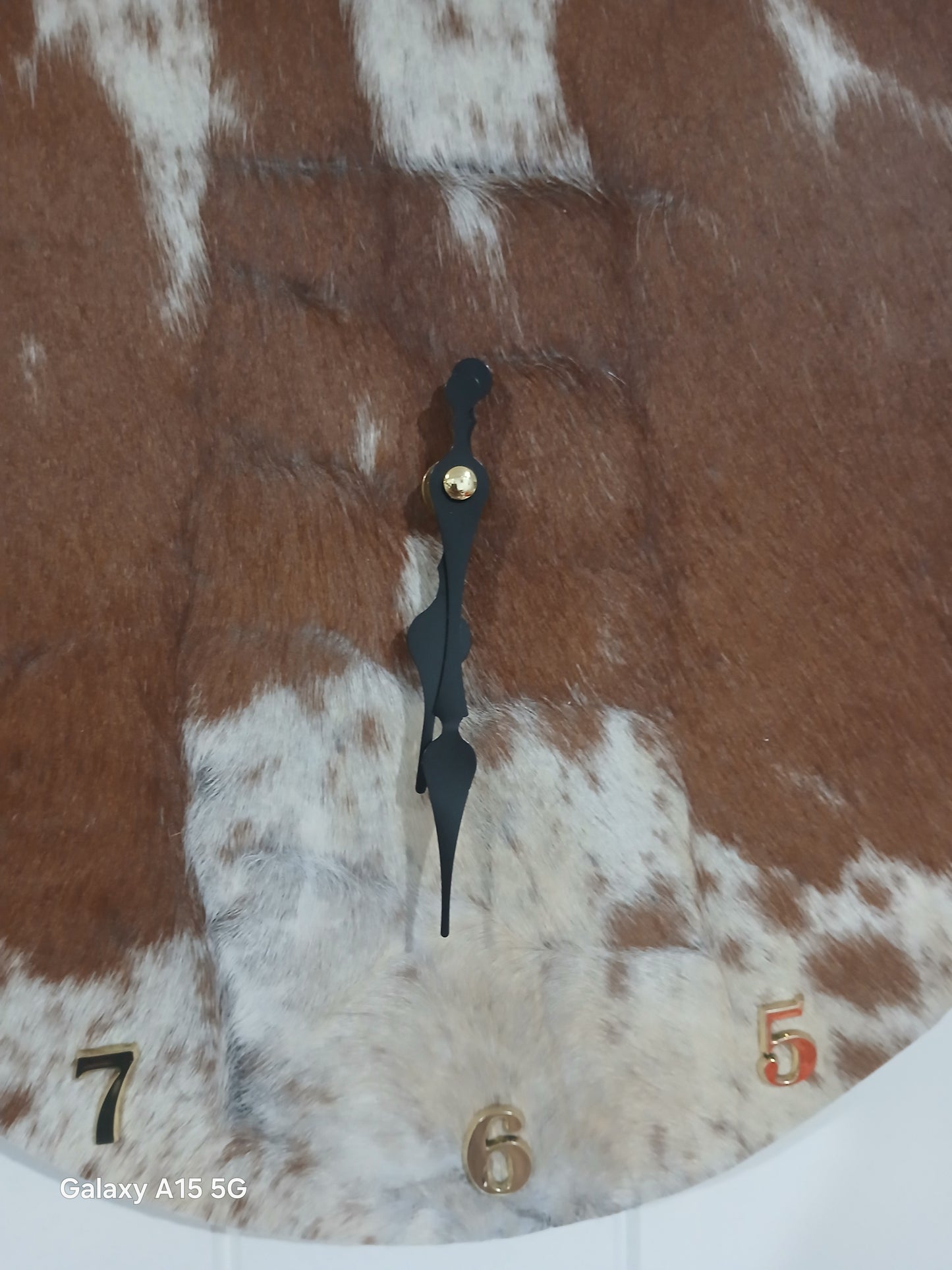Cowhide wall clock