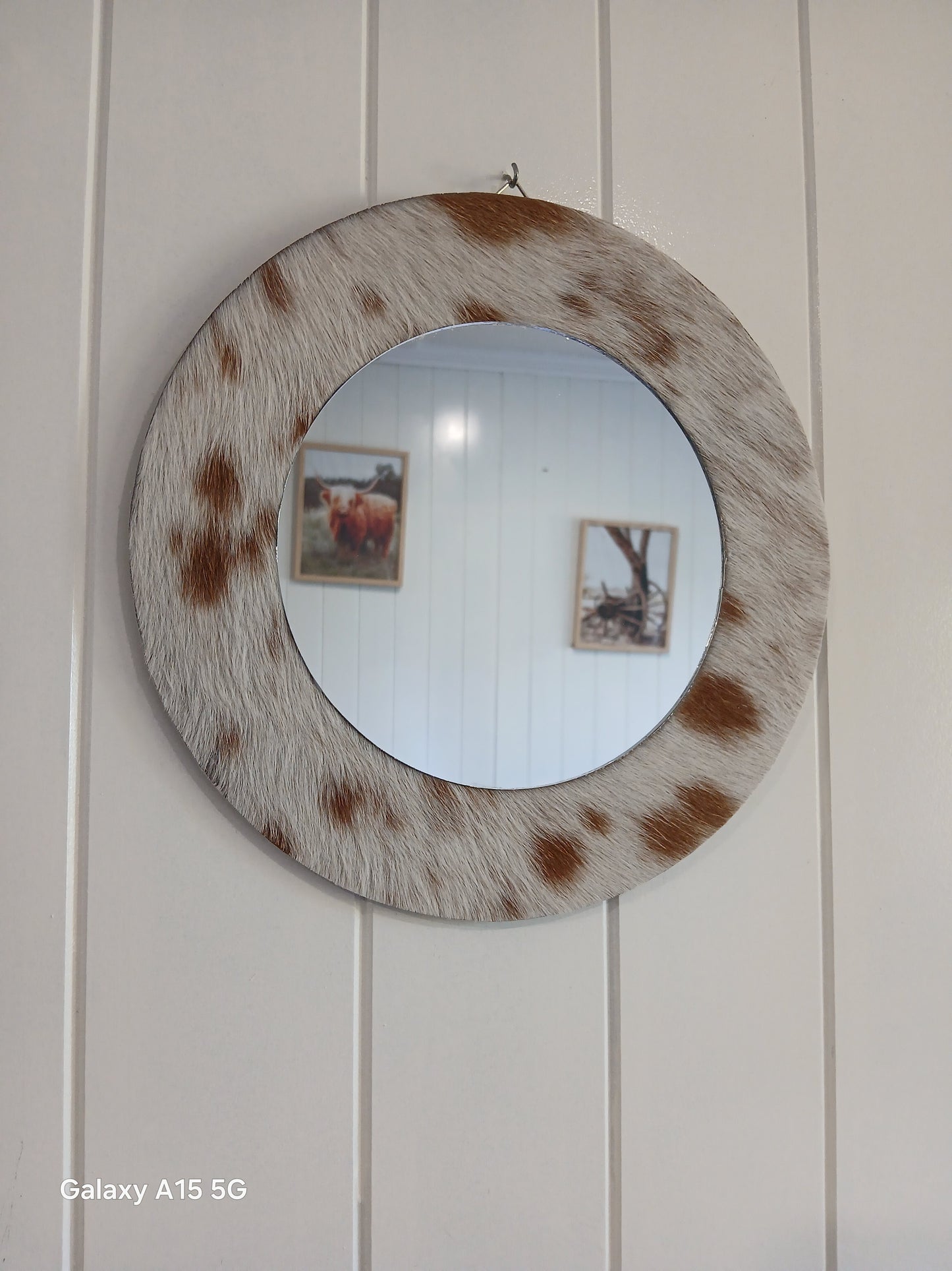 Cowhide wall mirror