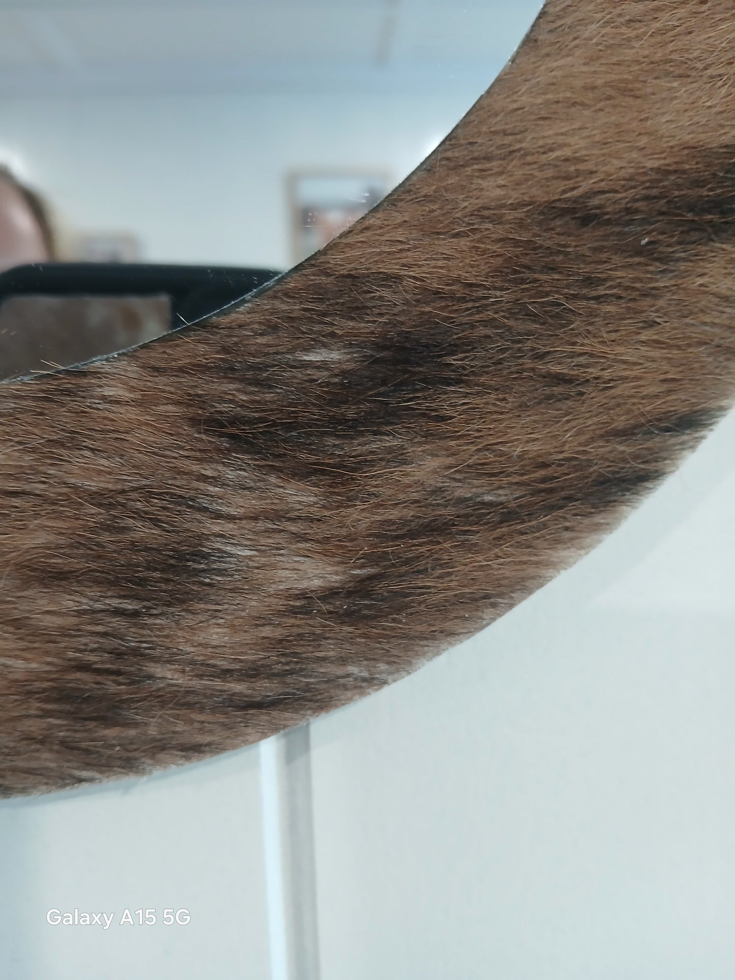 Cowhide wall mirror