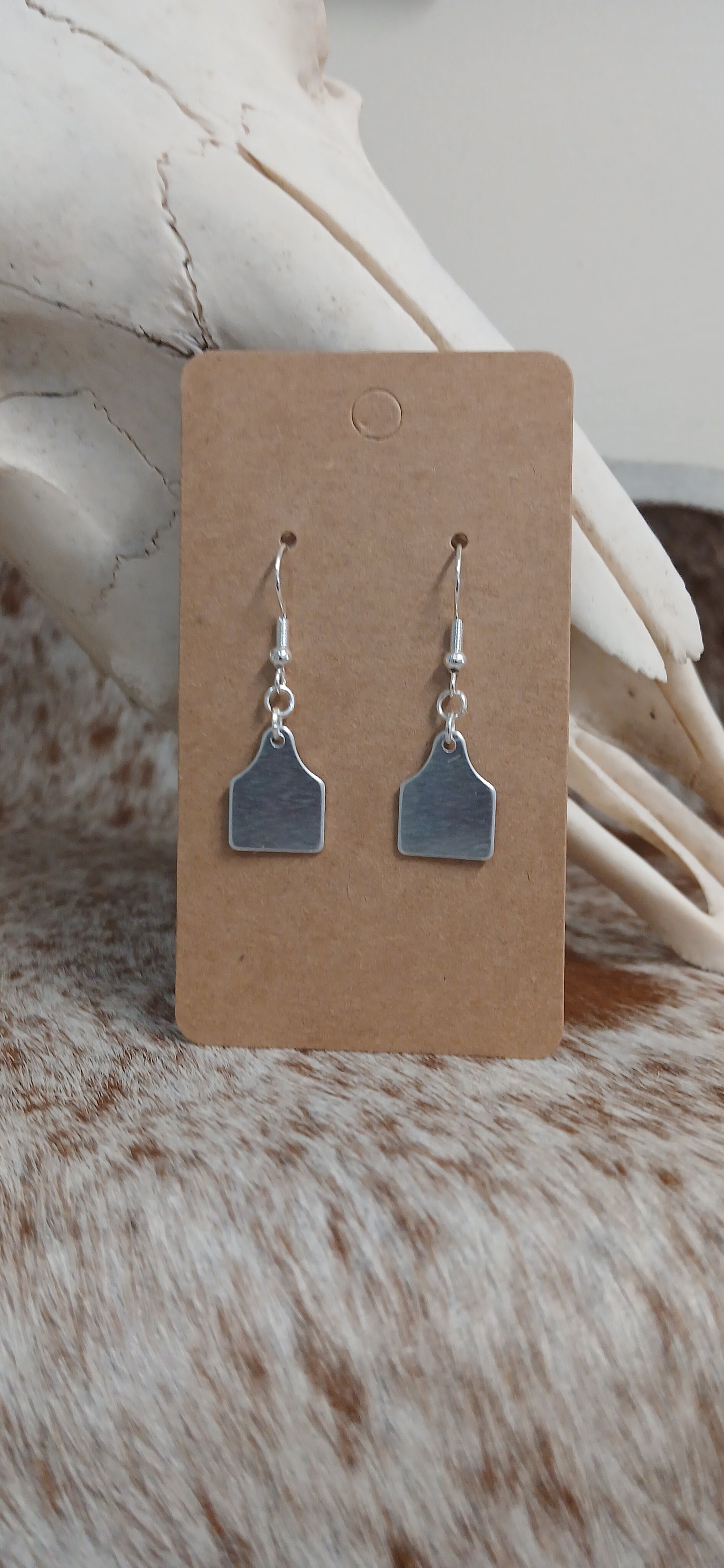 Dangle ear tag earrings