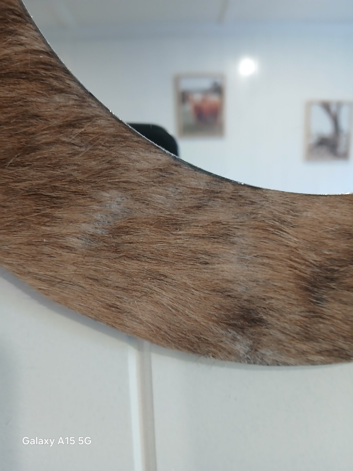 Cowhide wall mirror