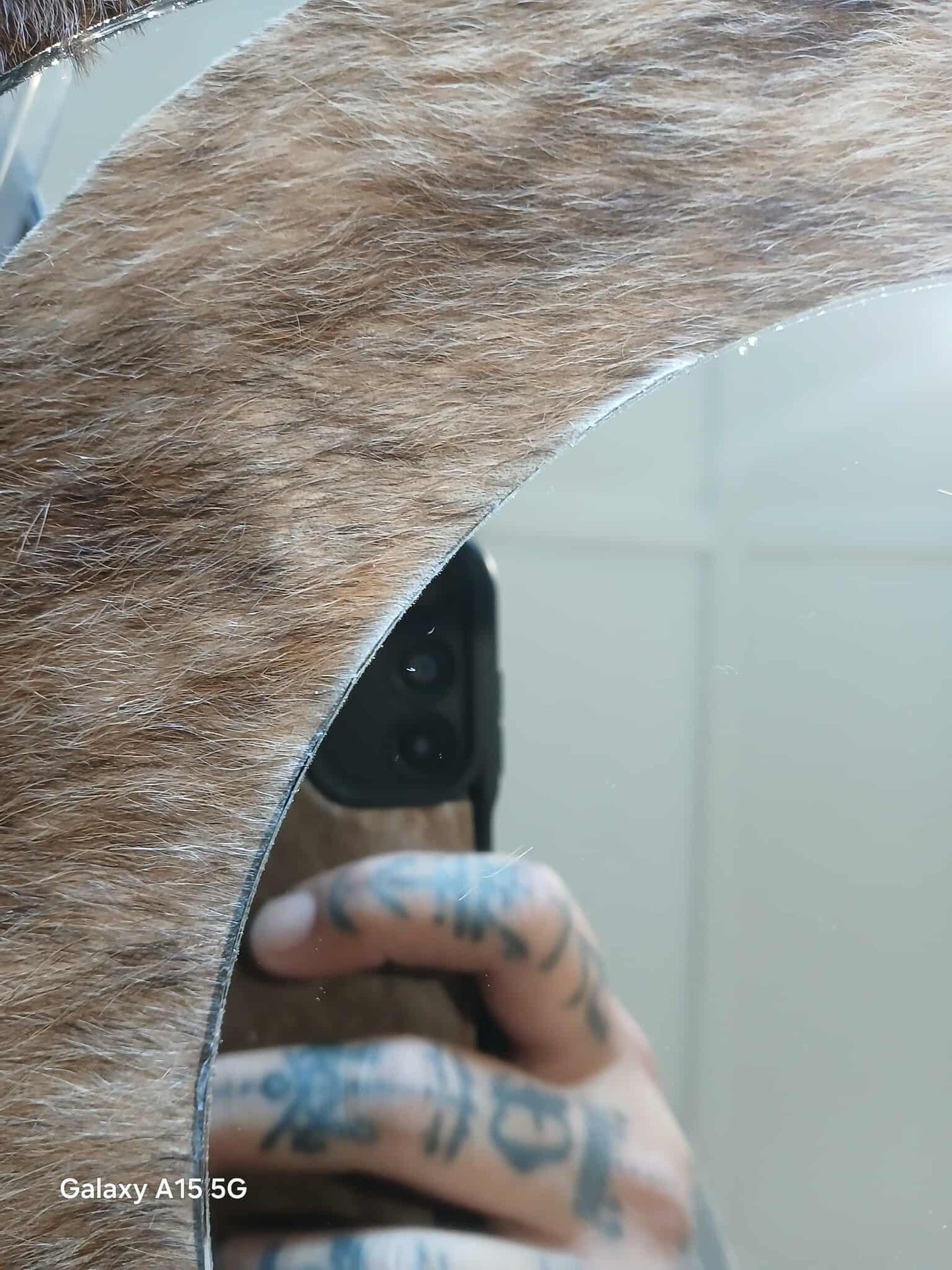 Cowhide wall mirror