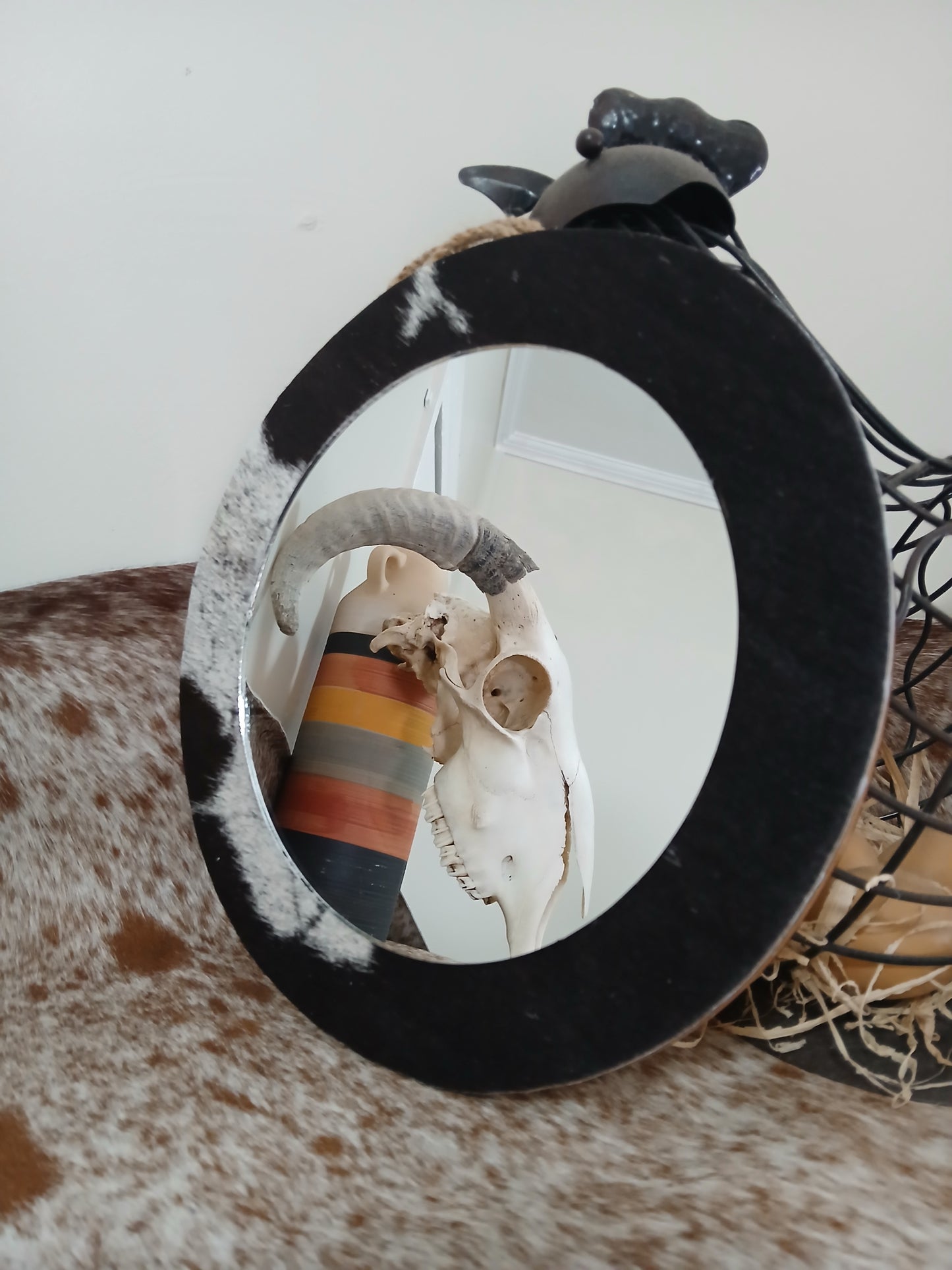 Cowhide wall mirror