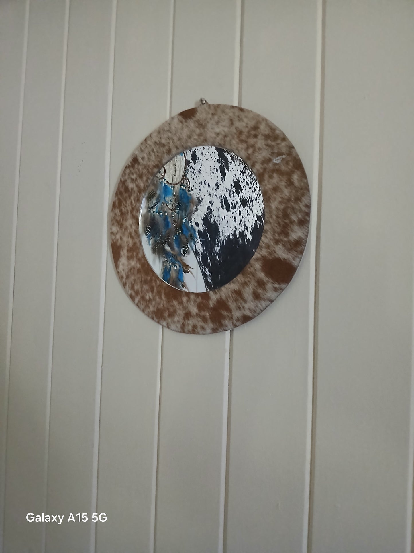 Cowhide wall mirror
